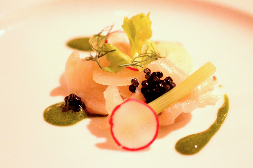 Lightly cured sturgeon with compressed pear, fennel, tapioca and parsley sauce.